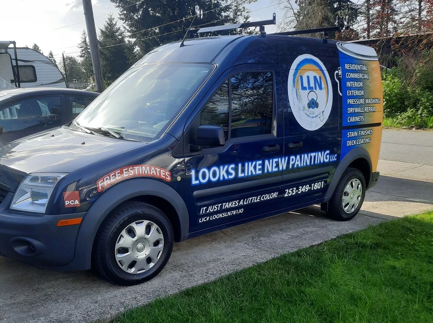 The original blue and saffron Looks Like New Painting company van